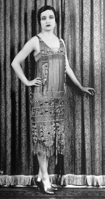 Black and white photo of Alice Joyce in a glamorous flapper dress during the 1920's.